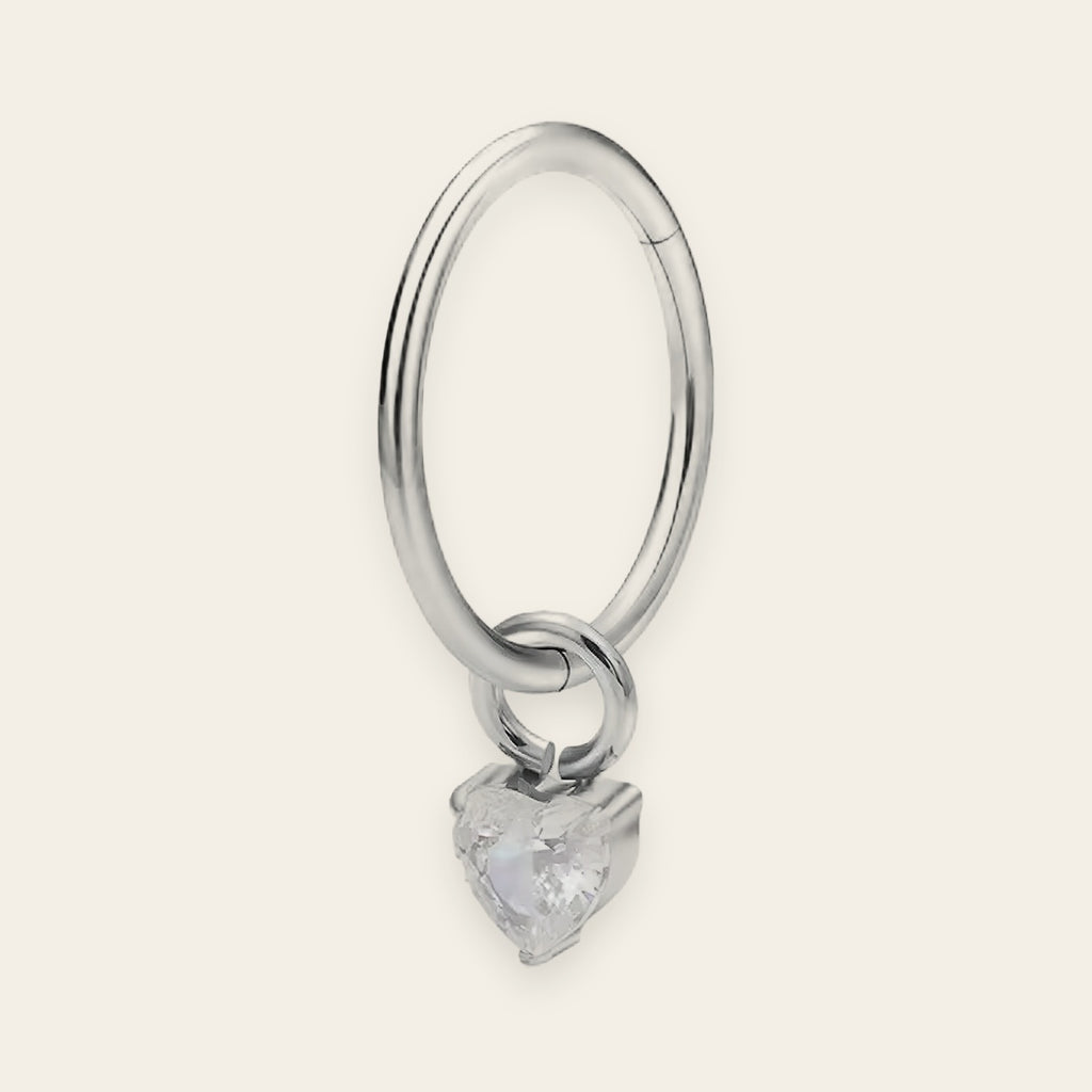 Silver titanium cartilage hoop with heart cubic-zirconia charm — plain hinged clicker ring, nickel-free, Aurea