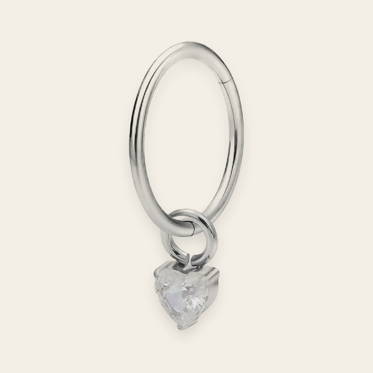 Silver titanium cartilage hoop with heart cubic-zirconia charm — plain hinged clicker ring, nickel-free, Aurea